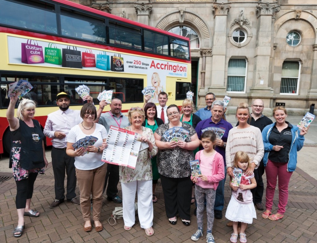 Cllr Clare Pritchard joins some of the retailers featured in the flyer at its official launch in Accrington.